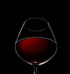 red wine in glass isolated on black
