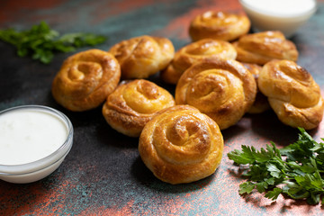 Traditional Balkan Cheese Pie spiral phyllo pastry served with yogurt. Serbian and Bosnian burek. Bulgarian banitsa. Turkish borek. Greek tiropita. Balkan cuisine. Close-up