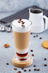 Latte Macchiato with Cocoa Powder and Coffee Beans