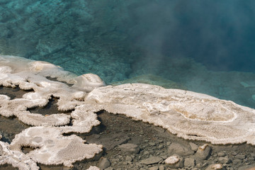 Geyser and hot spring in old faithful basin in Yellowstone National Park in Wyoming