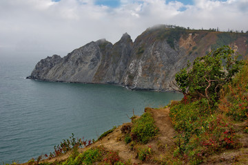 Fototapeta na wymiar Russia. Far East. Rocks of the sea of Okhotsk near the city of Magadan