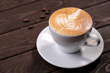 Cup of Hot Coffee with Picture on Foam Closeup
