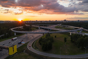 View from the air on the movement of cars on the overpasses at the intersection with the ring road...