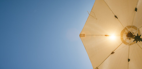 umbrella on blue summer sky