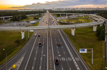 View from the air on the movement of cars on the overpasses at the intersection with the ring road...