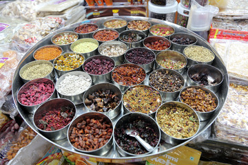 Different spices and herbs in metal bowls on a street market in Kolkata, India