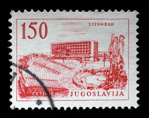 Stamp printed in Yugoslavia, shows Titograd (Podgorica) Hotel and Open-Air Theater in Cetinje, circa 1958