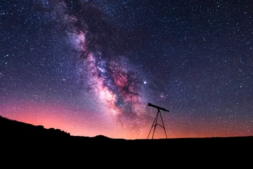Fotobehang Silhouette of a telescope at the starry night and bright milky way galaxy. © Inga Av