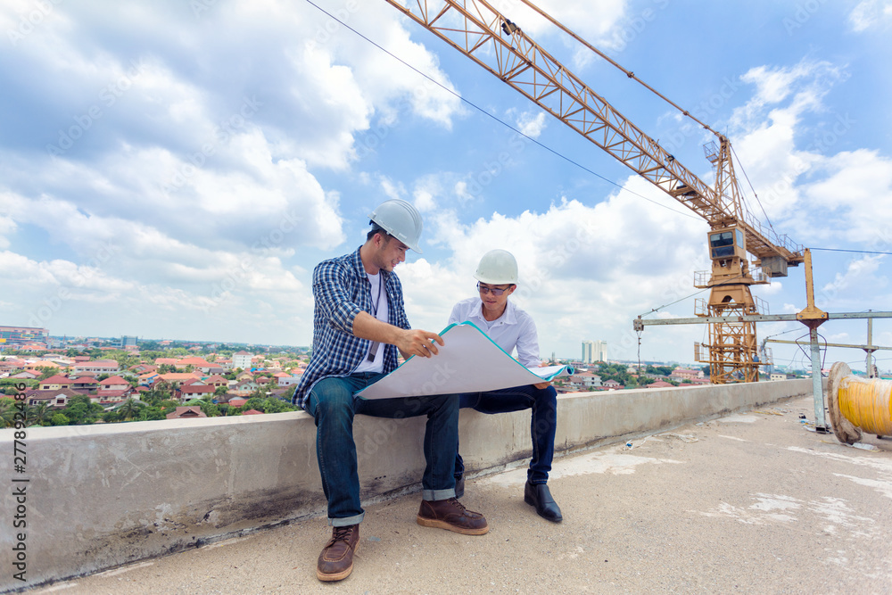 Aufkleber construction engineer checking plan on construction site for new infrastructure project. engineering