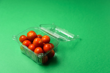 Fresh cherry tomatoes in disposable plastic package