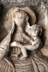 Fototapeta na wymiar Madonna with Child, Detail of grand gate of old town of Kotor, Montenegro