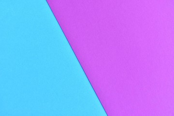 Two tone paper background with magenta and blue color. Blank colorful backdrop with empty space for image or text. Mockup concept. Neon empty paper background. Clean blue and pink wallpaper 
