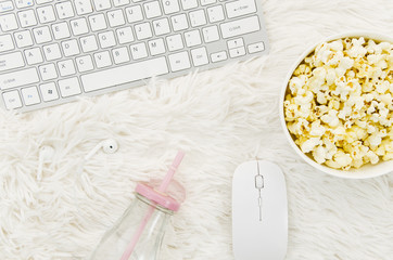 Flat lay of popcorn and laptop for cinema concept