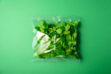 Fresh baby greens in disposable plastic package