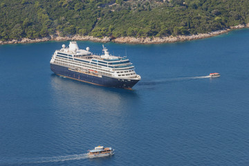 Deck ship anchored in the bay before the insel Lokrum in the Adriatic Sea near the city Dubrovnik. Sea travel in Croatia. Sea landscape of top view