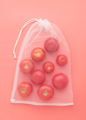 Natural Organic Tomatoes in String Bag Top View