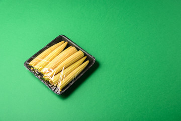 Fresh baby corn in disposable plastic package