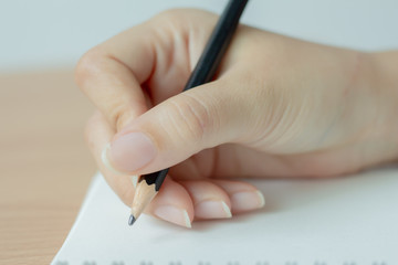 hand writing with pen on paper