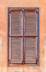 Windows with old wooden shutters