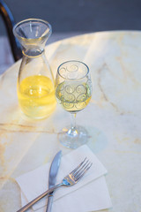 White wine in a liter bottle on a table in a cafe