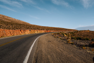 Fototapeta na wymiar Cinematic road landscape. Humahuaca valley, Altiplano, Argentina. Misty road