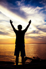 Fototapeta premium Man Silhouette with Hands Up
