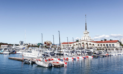 The building of the Sochi sea station and the yacht on the pier