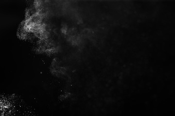 White powder explosion on black background.