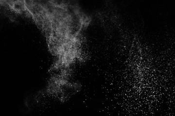 White powder explosion on black background.