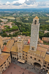 Fototapeta na wymiar Panoramic aerial view of the city and surrounding countryside from the towers of San Gimignano in Tuscany, Italy