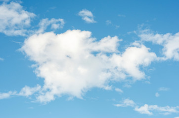 Naklejka na ściany i meble Blue sky and white clouds with blurred background patterns