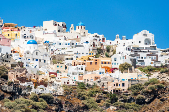 Homes, accommodation, and restaurants at the village of Oia in the north of the island of Santorini, Greece.