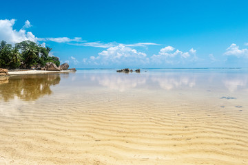 Beautiful sandy beach on the island of La Digue, Seychelles. Summer vacation holiday concept. Copy space