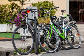 Fototapeta na wymiar Parked bicycles at the beautiful streets of Pisa