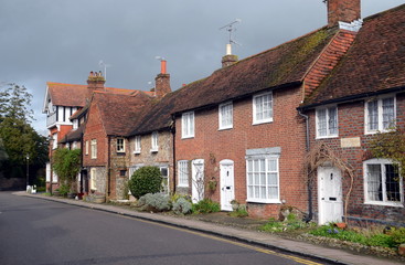 Fototapeta na wymiar Arundel, United Kingdom - March 29, 2015 - Row of typical English houses with traditional streets and architecture in a small town of Arundel.