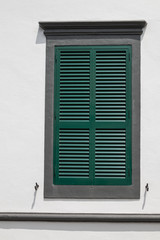 Window with a closed green shutter