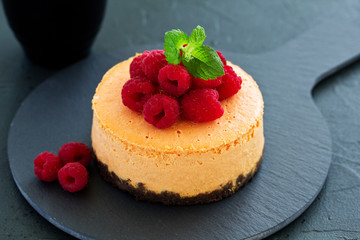 Pumpkin cheesecake with raspberries. Selective focus.