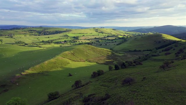 Aerial View over Green Countryside Hills