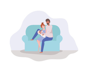 parents taking care of newborn baby in the couch