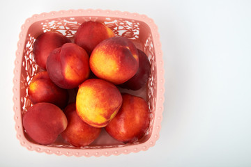 Ripe juicy nectarines isolated on white background