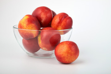Ripe juicy nectarines isolated on white background