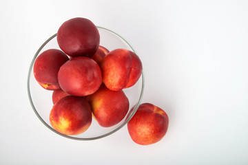 Ripe juicy nectarines isolated on white background