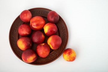 Ripe juicy nectarines isolated on white background