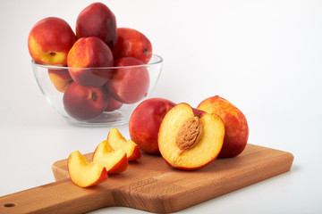 Ripe juicy nectarines isolated on white background