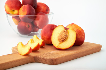 Ripe juicy nectarines isolated on white background