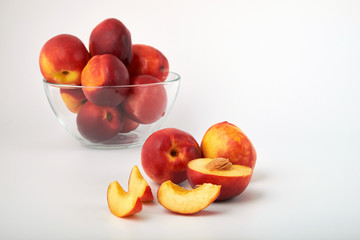 Ripe juicy nectarines isolated on white background