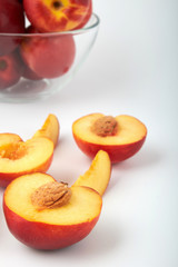 Ripe juicy nectarines isolated on white background