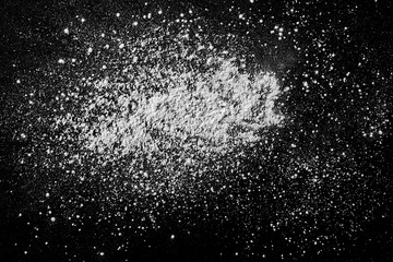 White powder isolated on black background, top view with clipping path