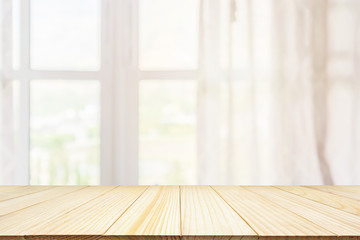 Empty wood table top with window curtain abstract blur background for product display