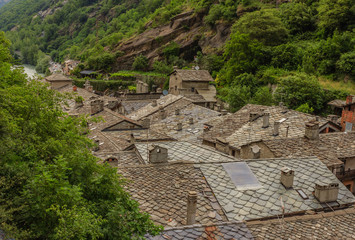 view of stone roofs called the losa roofs of an ancient valdostan village in Italy.  the losa are stone slabs,  dating back to the 1400-1600 century, extracted  from the mountain and laid to the roofs